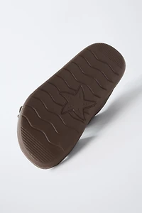 RUBBERIZED BUCKLED SANDALS