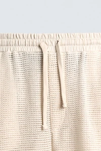 PANTALON COUPE DÉCONTRACTÉE STRUCTURE OUVERTE