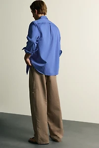 RELAXED FIT PLEATED PANTS