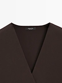 Crossover knit vest with tie detail