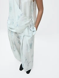 Flowing halterneck top with tie detail