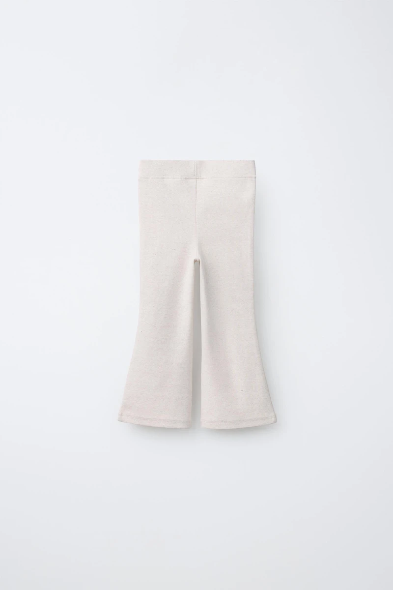 LEGGING FLARE INTERLOCK DÉCOR ÉTIQUETTE