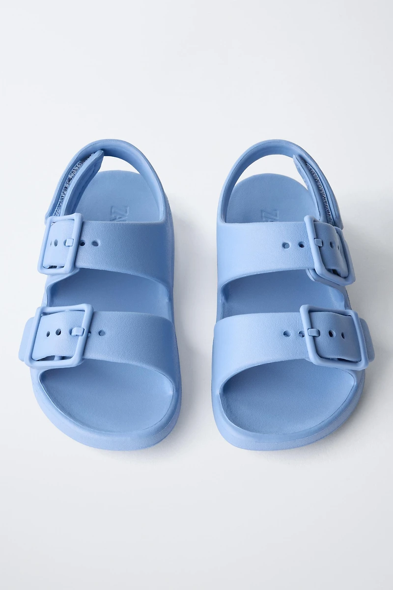 RUBBERIZED BUCKLED SANDALS