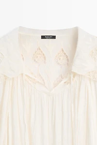 Embroidered flowing blouse