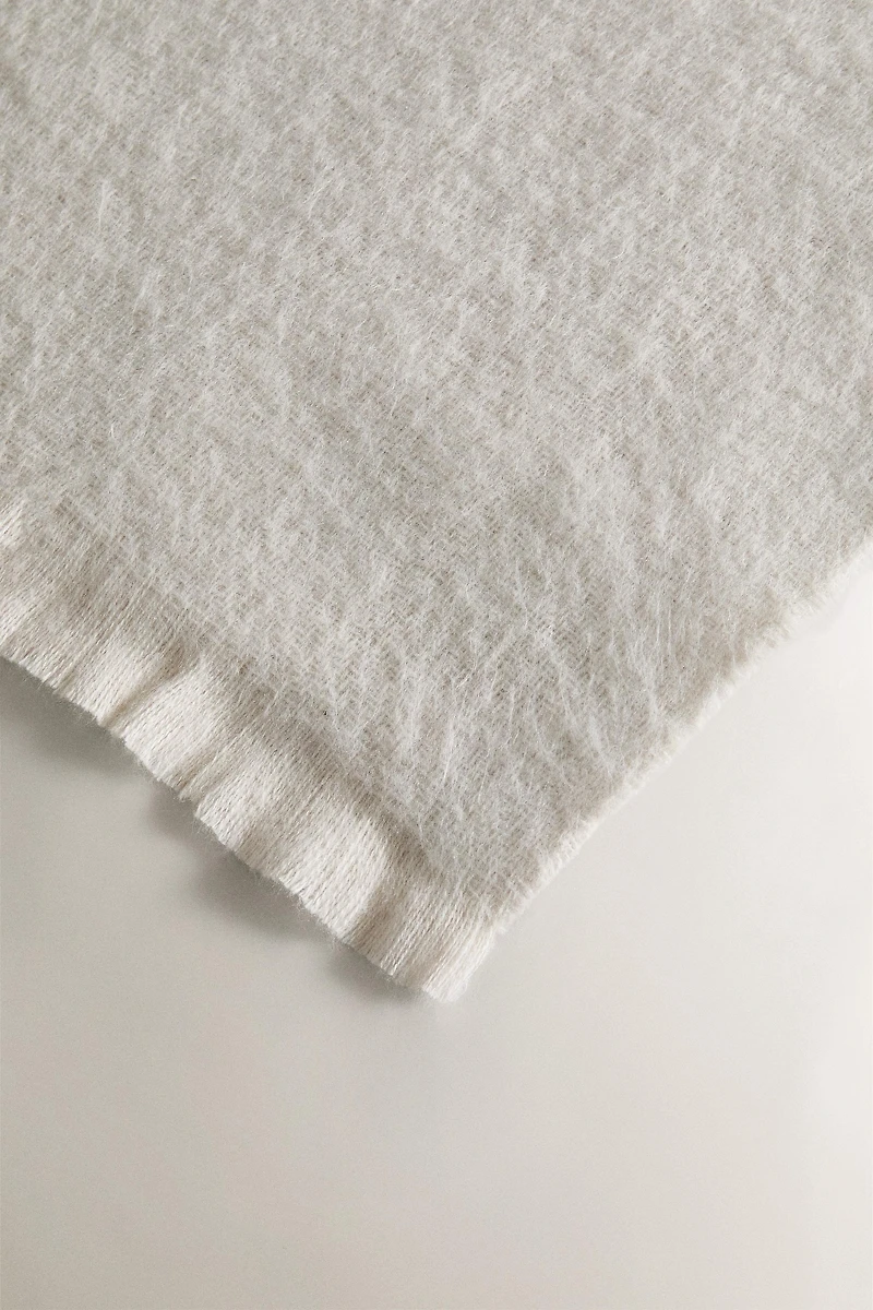 PLAID DOUX À FRANGES