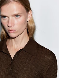 Polo laine en maille tressée