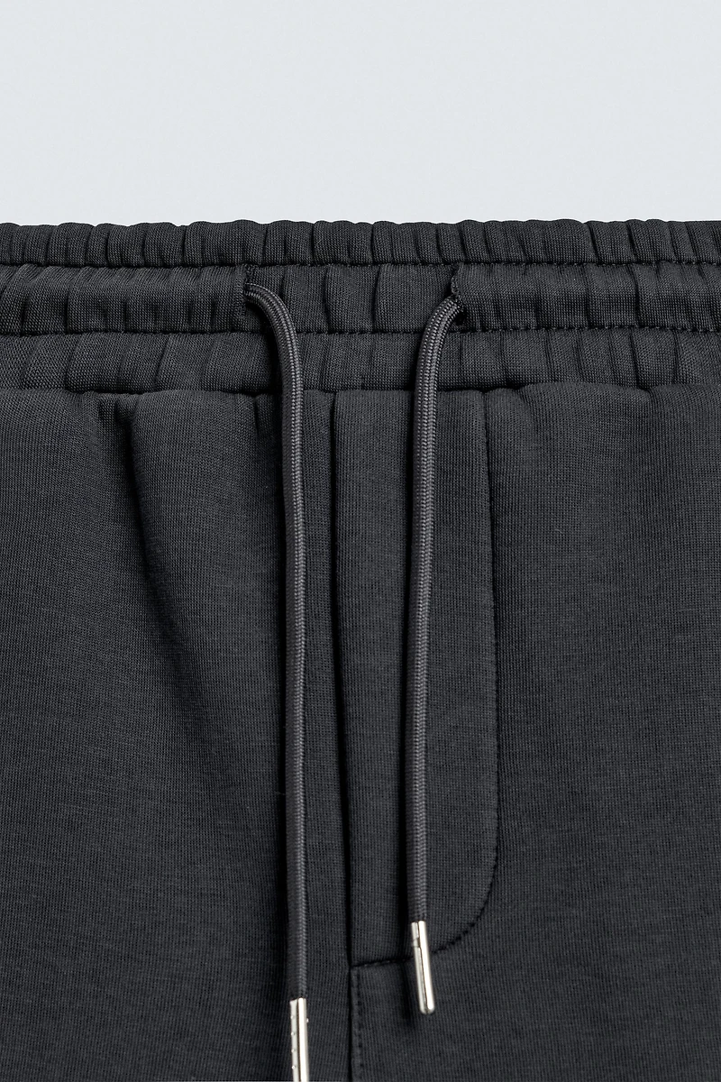 RELAXED FIT INTERLOCK JOGGING PANTS