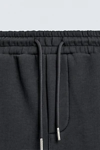 RELAXED FIT INTERLOCK JOGGING PANTS