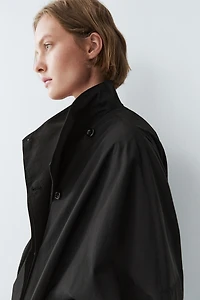 Veste technique à bouton latéral en coton