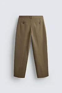 LIMITED EDITION RELAXED FIT PLEATED PANTS