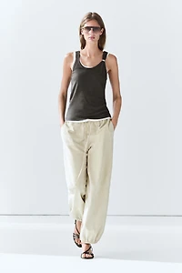 Double-layer strappy top with jewel detail