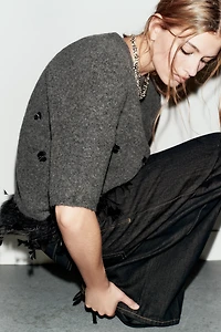 WOOL SWEATER WITH SEQUINS AND FEATHERS