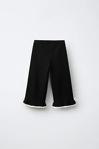 FLARED KNIT PANTS WITH BOWS AND RUFFLE
