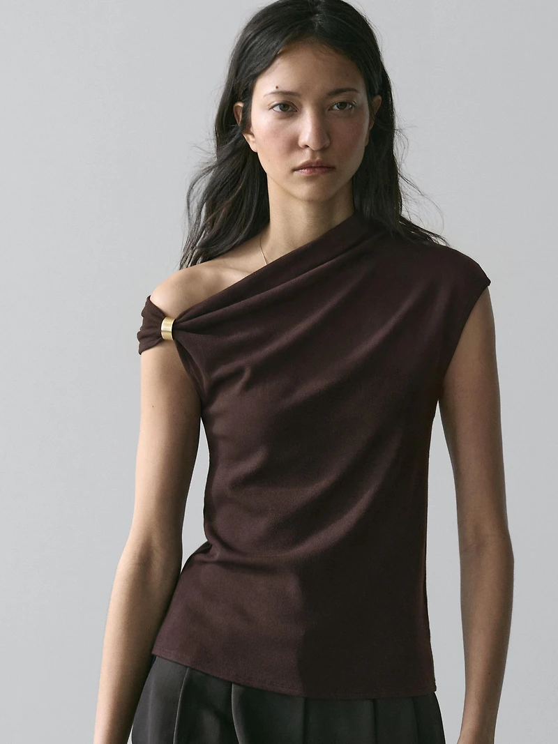 Asymmetric top with brooch detail