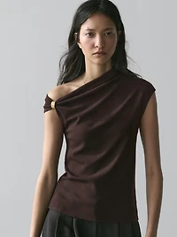 Asymmetric top with brooch detail