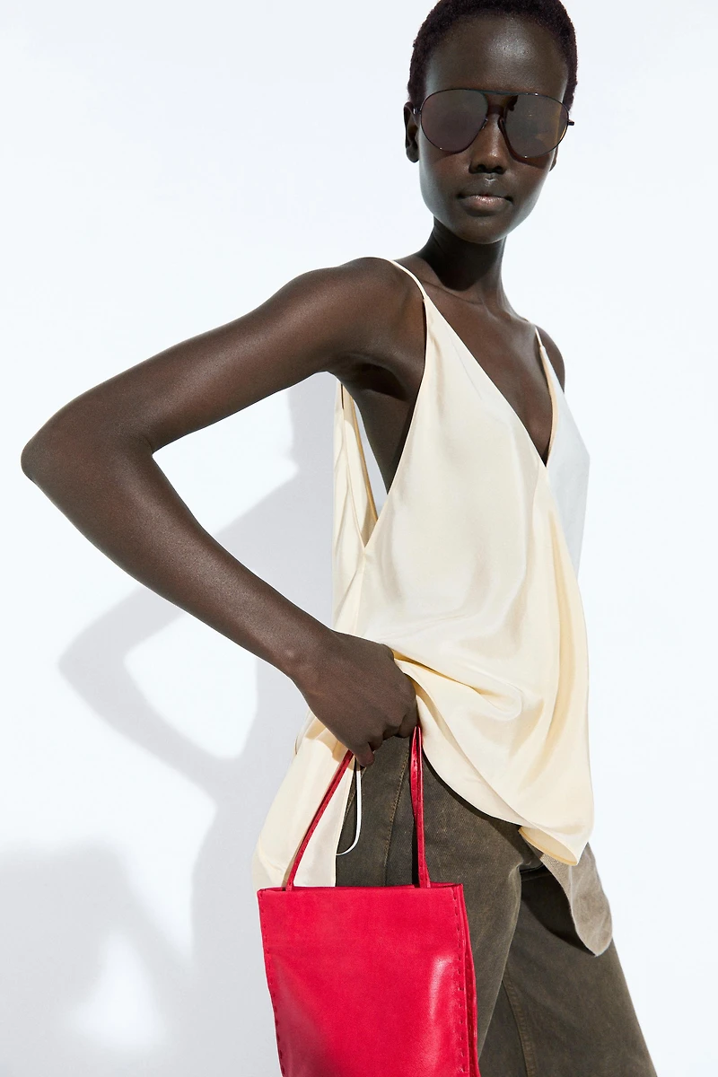 Asymmetric strappy flowing top