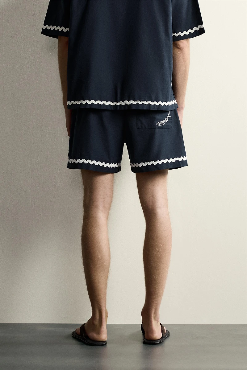 SHORT COURT BRODERIE POISSON