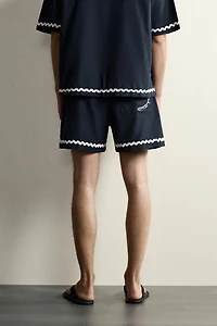 SHORT COURT BRODERIE POISSON