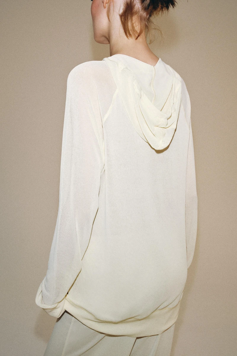 SEMI-SHEER FLOWY SWEATSHIRT