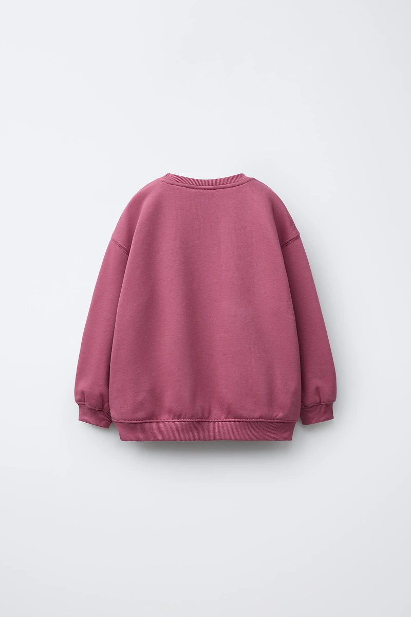 RAISED PRINT SWEATSHIRT
