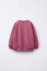 RAISED PRINT SWEATSHIRT