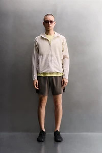 TECHNICAL WINDBREAKER JACKET