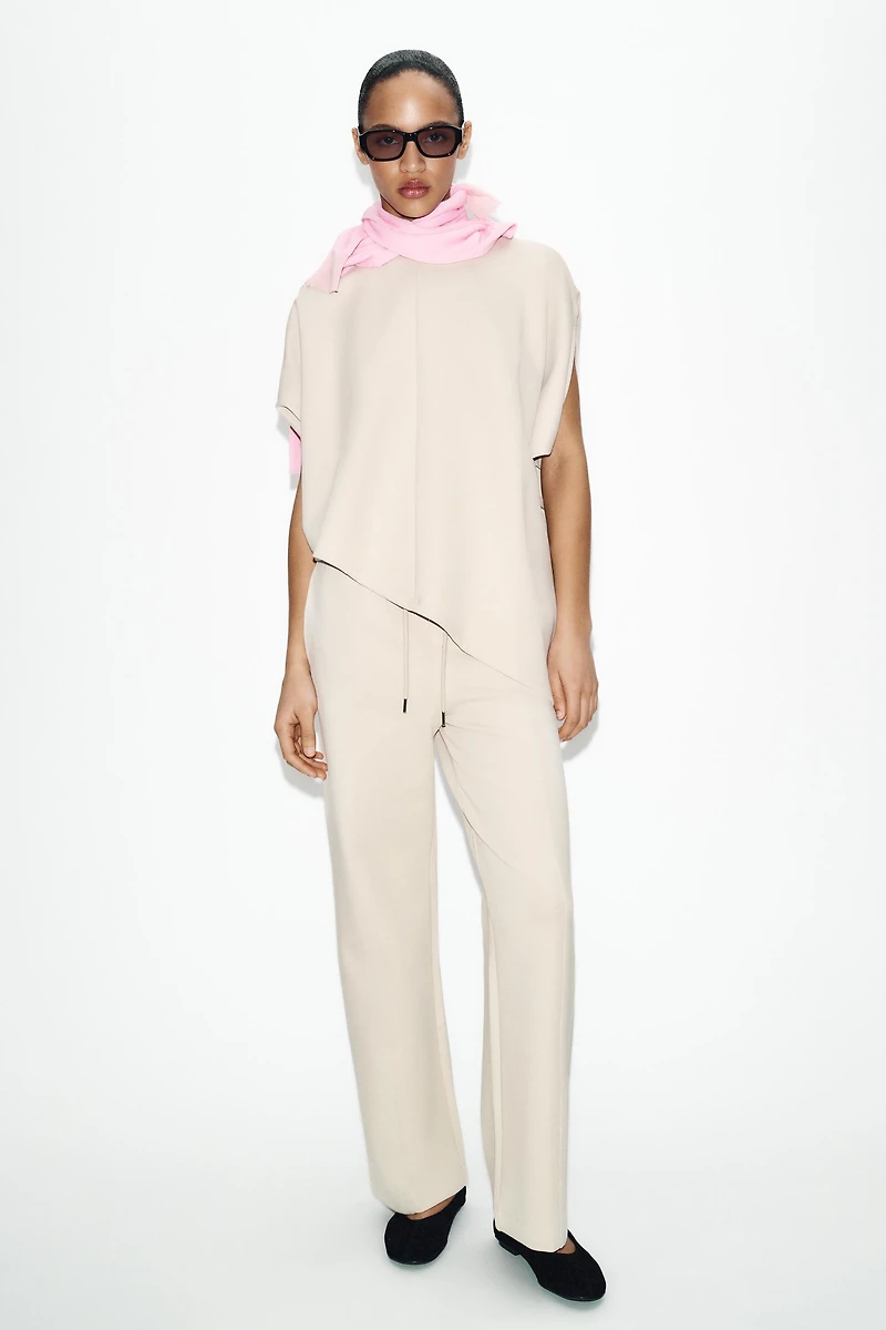ASYMMETRIC INTERLOCK CAPE