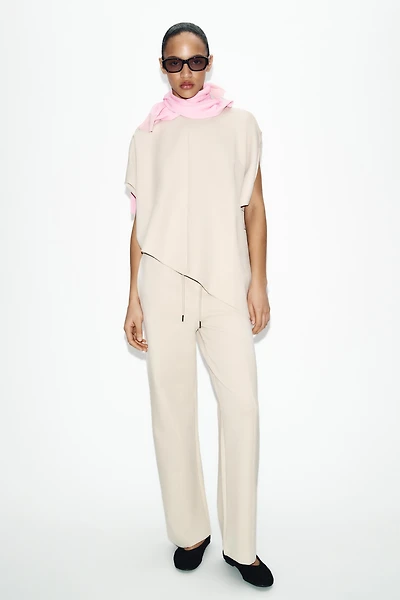 ASYMMETRIC INTERLOCK CAPE