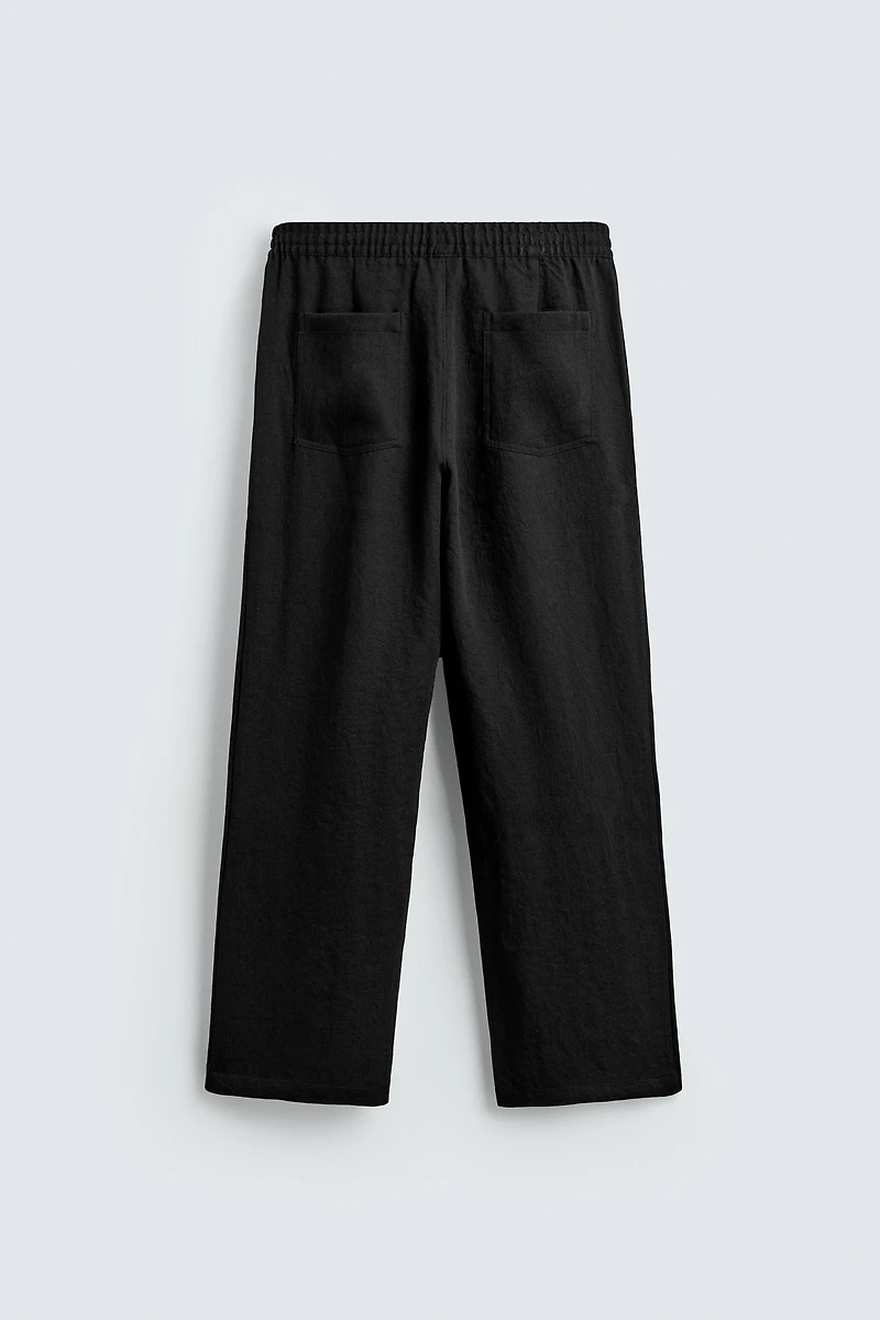 FLOWY PLEATED PANTS