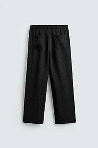 FLOWY PLEATED PANTS