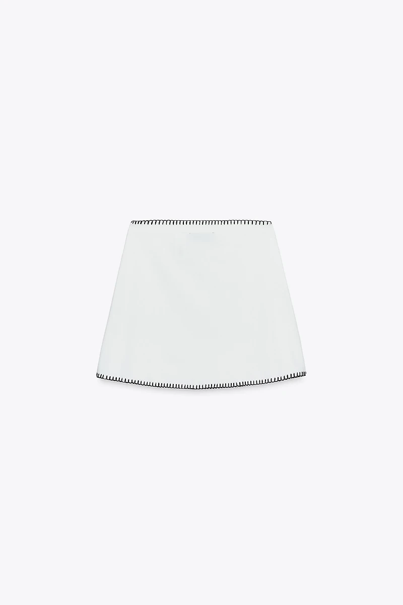 JUPE EN MAILLE BRODERIES CONTRASTE