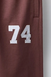 EMBROIDERED NUMBER JOGGING PANTS