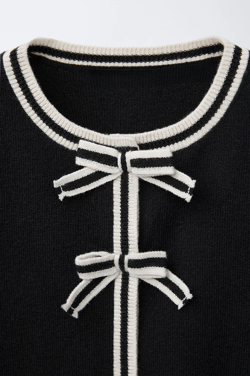 GILET EN MAILLE À NŒUDS