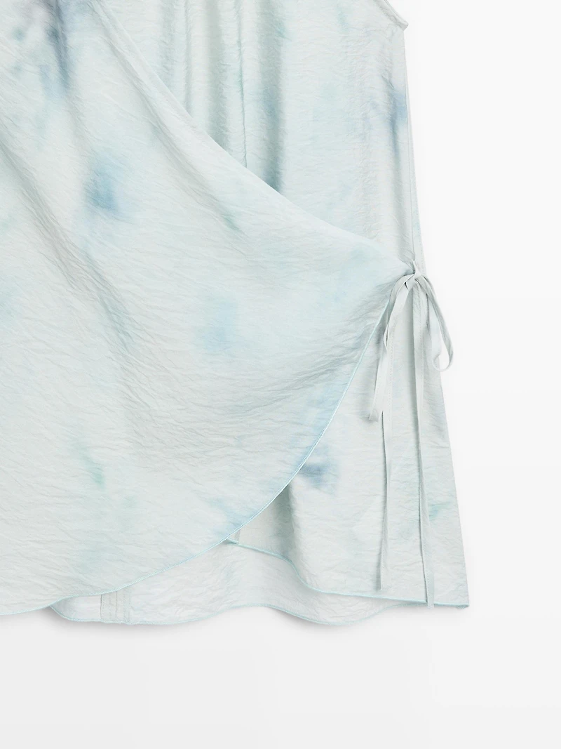 Flowing halterneck top with tie detail