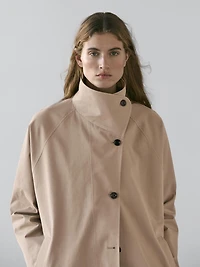 Long 100% cotton trench coat with side fastening