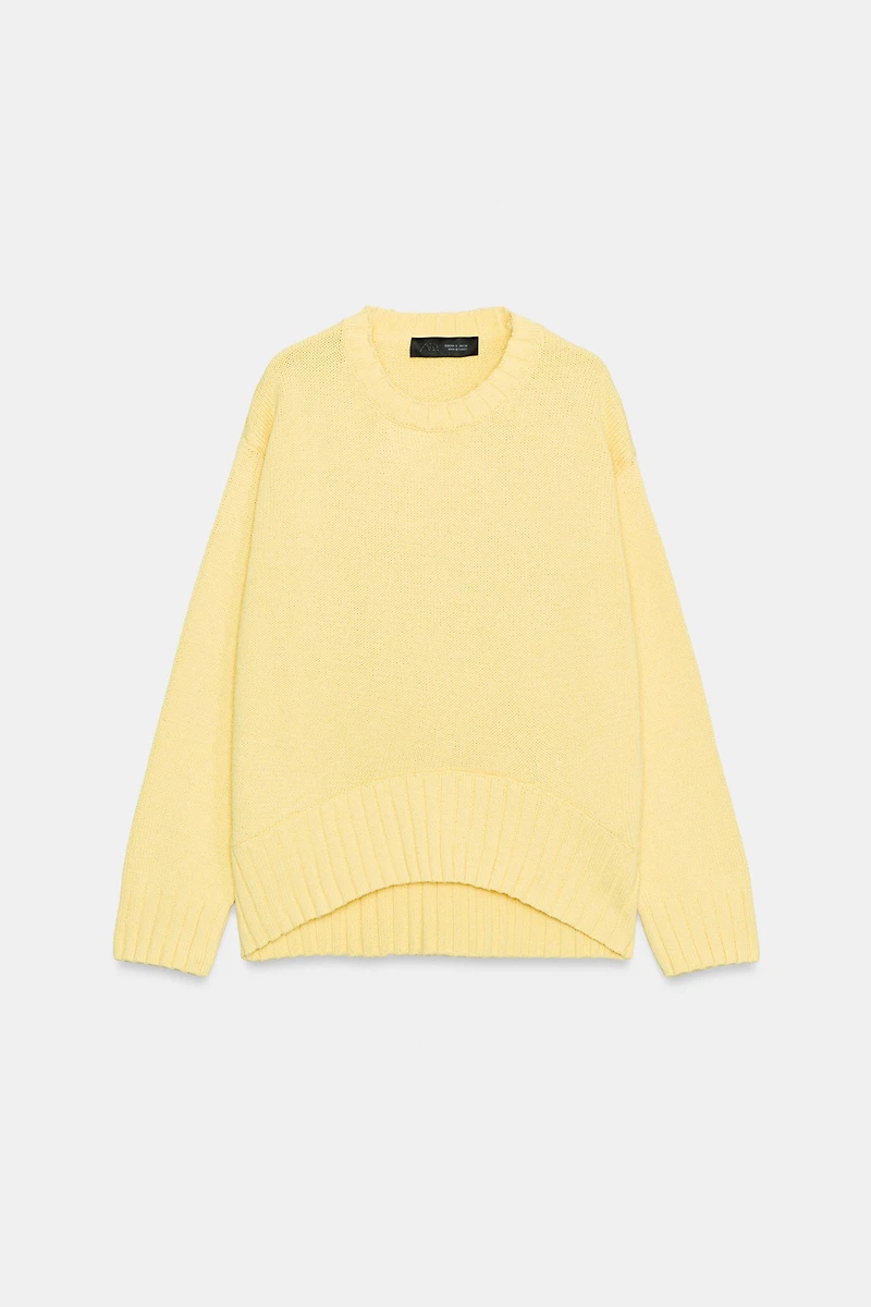 PULL EN MAILLE À BAS ASYMÉTRIQUE