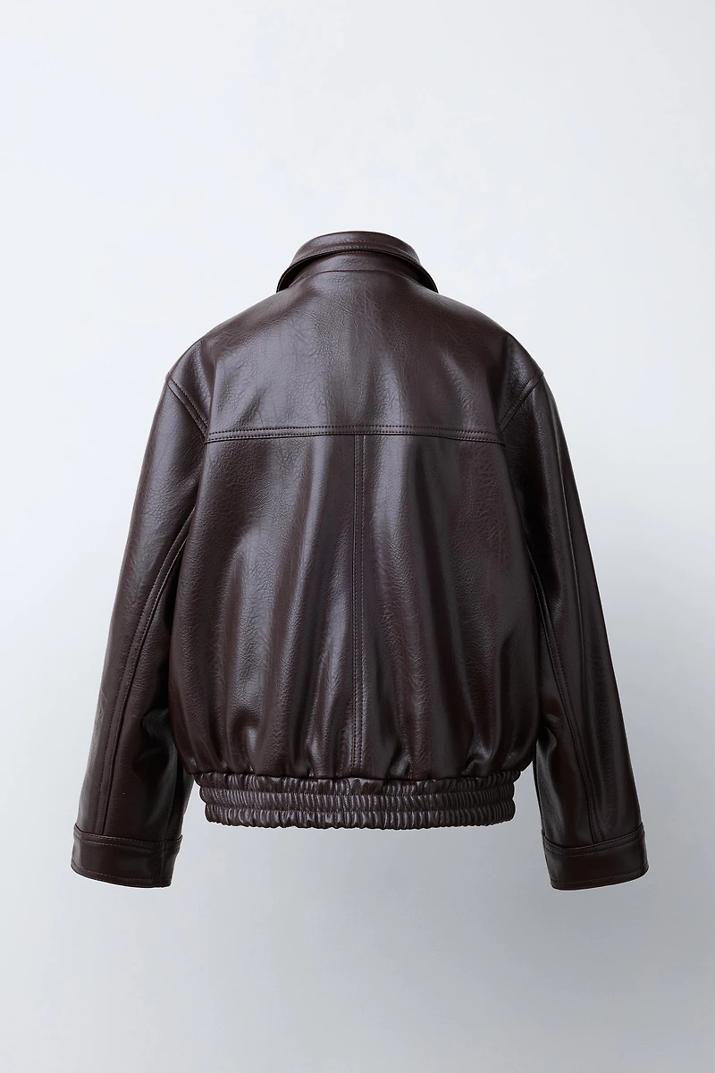 BLOUSON EN MATIÈRE SYNTHÉTIQUE À POCHES