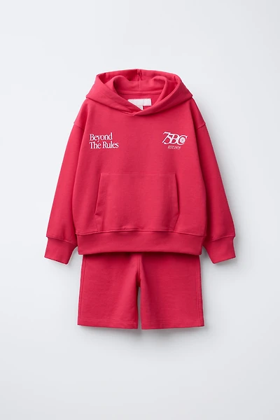 ENSEMBLE SWEAT À CAPUCHE ET BERMUDA INSCRIPTION