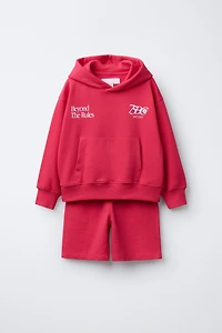 ENSEMBLE SWEAT À CAPUCHE ET BERMUDA INSCRIPTION