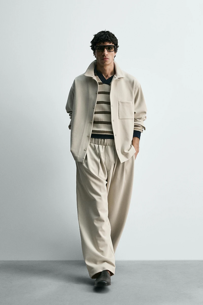 INTERLOCK PLEATED PANTS
