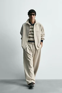 INTERLOCK PLEATED PANTS