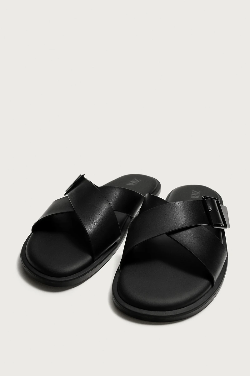 BUCKLED CRISSCROSS SANDALS