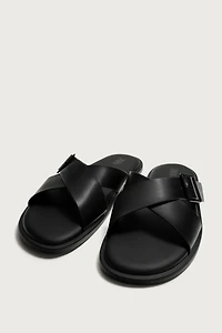 BUCKLED CRISSCROSS SANDALS