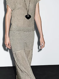 Long pleated skirt with flecked detail
