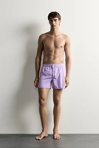 MID-LENGTH SWIMSUIT WITH VENTS