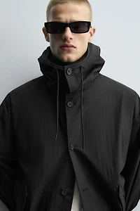 BLOUSON TECHNIQUE À CAPUCHE