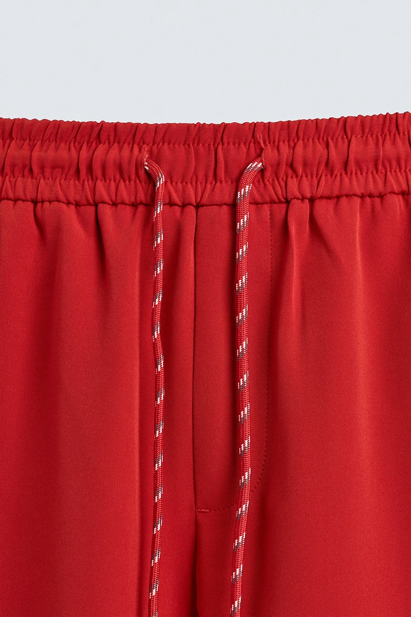 WIDE FIT JOGGER PANTS WITH SIDE STRIPES