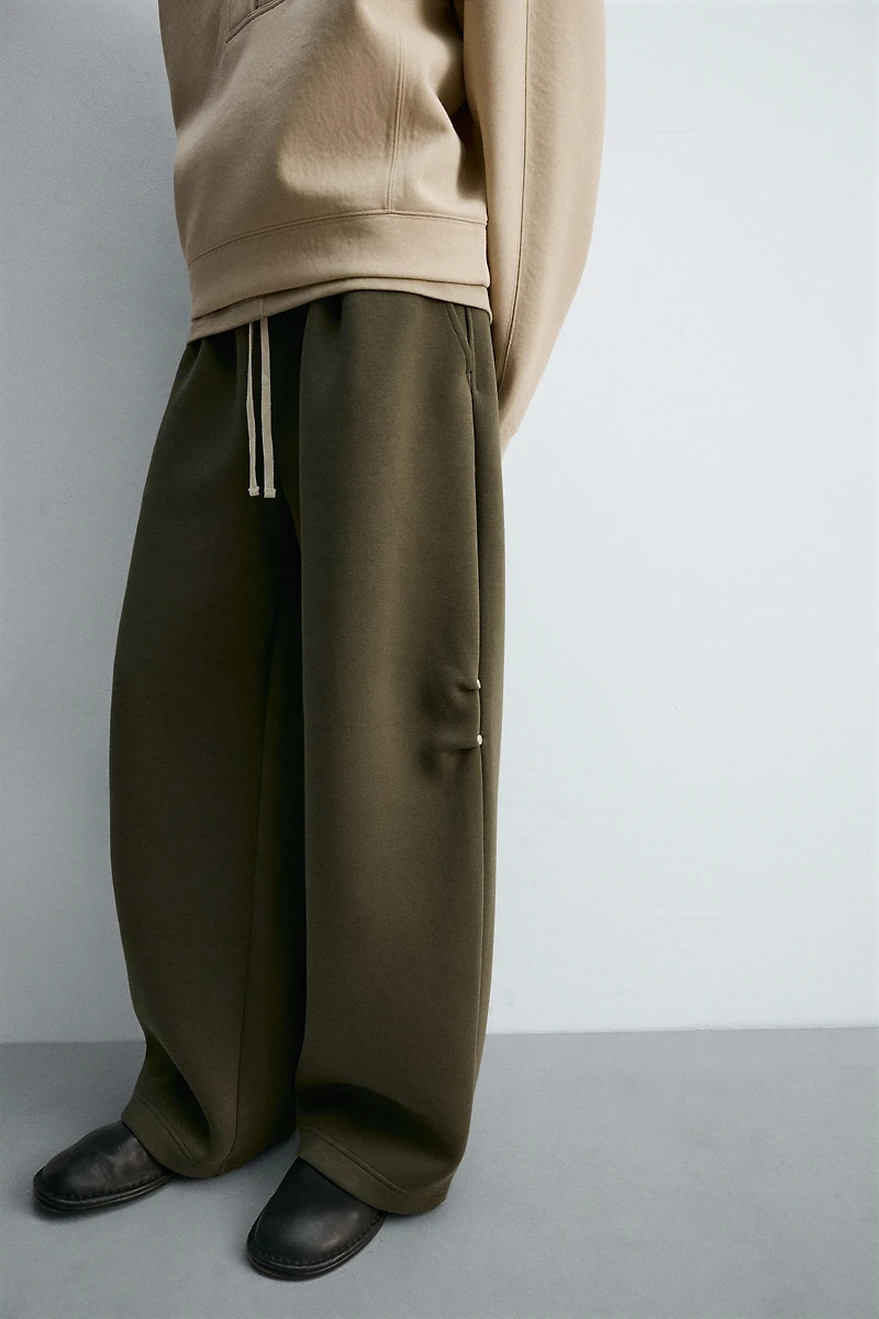 WIDE FIT NEOPRENE EFFECT PANTS WITH STUDS