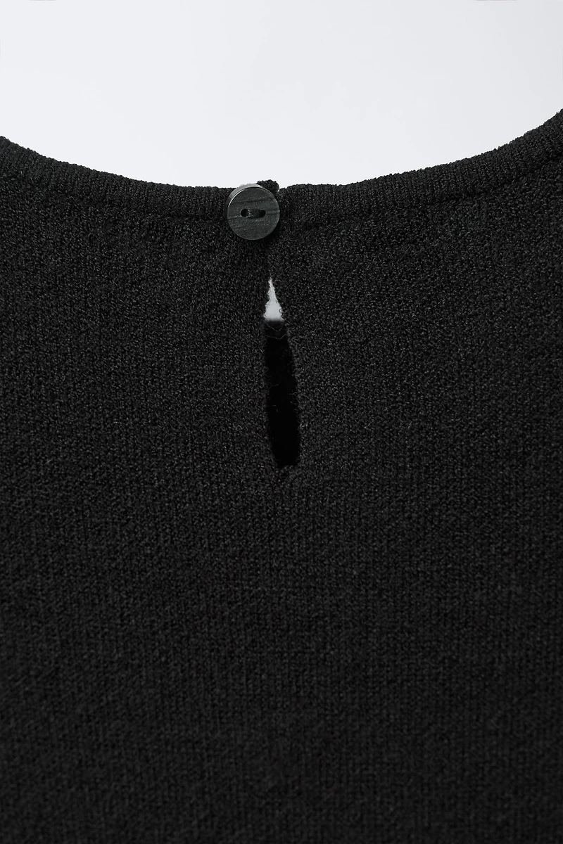 ROBE EN MAILLE AVEC NŒUD ET PAILLETTES