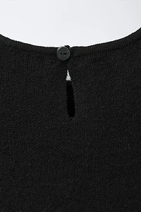 ROBE EN MAILLE AVEC NŒUD ET PAILLETTES